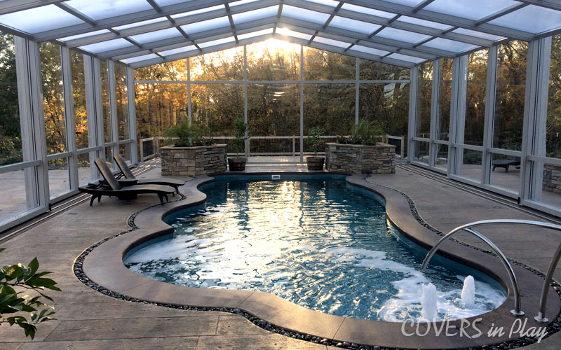 Interior view of pool with dome in Des Moines, IA, with fountain
              and beautiful sunset.