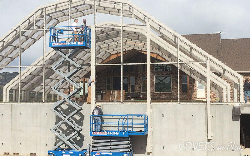 Exterior view of pool dome construction in Nephi, UT, showing the frame
              assembly.