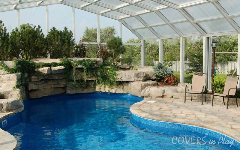Interior view of swimming pool dome in Sharon, ON, with lush landscaping.